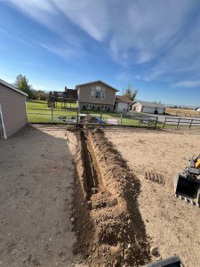 Excavation site for underground utility line installation.